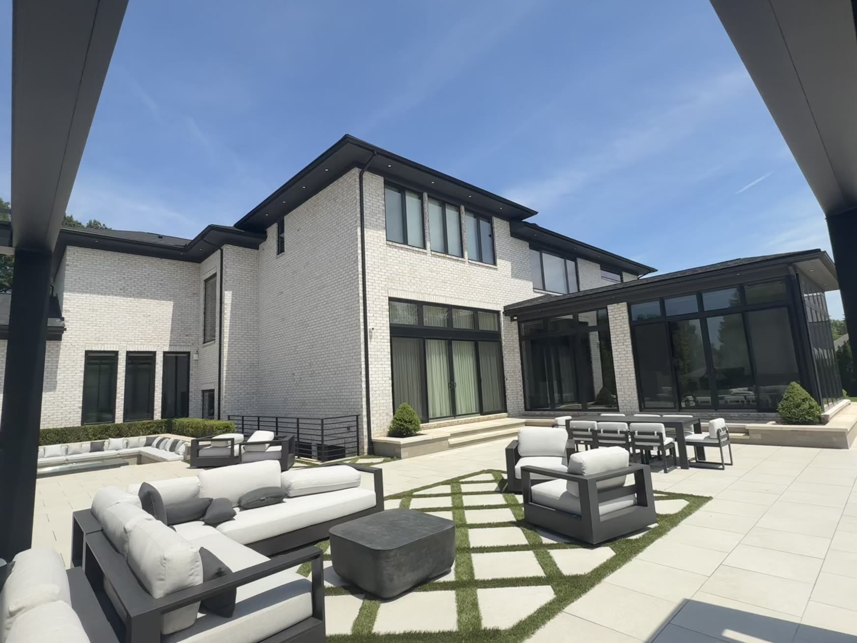 Contemporary Metro Detroit estate with floor-to-ceiling glass and sunroom after Apex Exteriors window cleaning